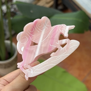 Pink marble acetate hair claw clip in a cute cartoon animal shape for women's hairstyle