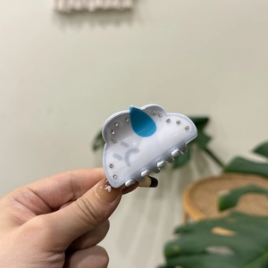 Cute white acrylic cloud hair claw clip with blue water droplets and sparkling rhinestones