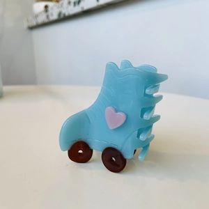 Blue roller skate claw clip with pink heart detail for sweet summer hair styling