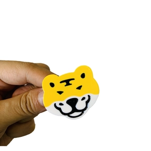 Cute cartoon tiger acetate hair clip with yellow and black colors in Y2K style