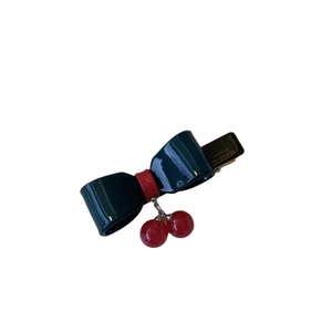 French style acetate hair clip with dark green bow and red cherry pendants and gold text