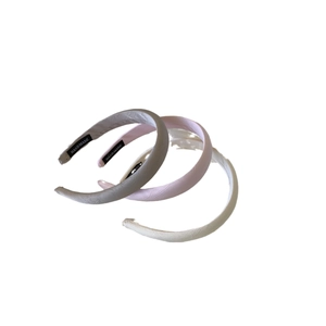 Three-piece handmade satin headbands in silver-grey, light pink, and creamy white tones