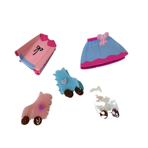 Pink top and blue skirt shape hair claws with roller skate hair clips on white background