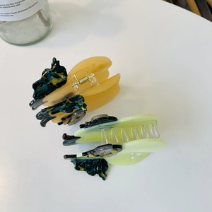 Set of two elegant butterfly acetate hair claws in yellow and light green colors
