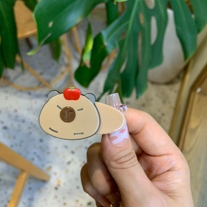 Cute Capybara hair clip with red apple detail, stylish cartoon accessory for girls