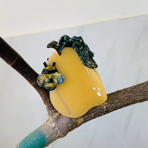 Creative pear-shaped acetate hair claw clip with honeybee and blue leaf on a branch