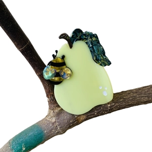 Pear and bee cellulose acetate hair claw clip on a natural tree branch background