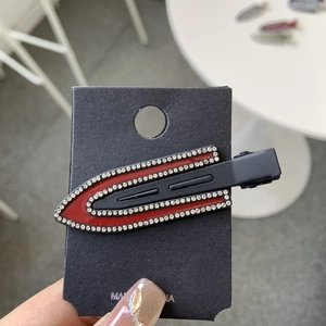 Sparkling dark red rhinestone duckbill hair clip with luxury matte finish on card