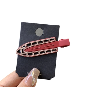 Elegant Ankara red rhinestone hair clip with geometric cutout and luxury duckbill style