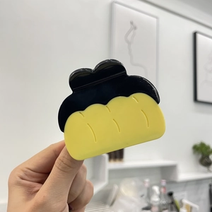 Creative bread-shaped hair claw clip in yellow and black acetate for women's hairstyles