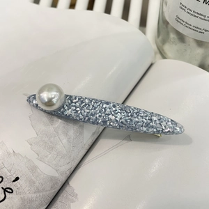 Elegant light blue resin duckbill hair clip with glitter finish and pearl accent