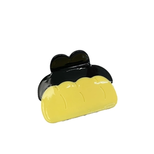 Creative pumpkin-shaped acetate hair claw clip with yellow and black color blocking