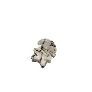 Polished acetate hair claw clip with black and white marble pattern and gold lettering