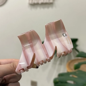 Molla per capelli in acetato marmorizzato rosa e bianco con cristallo e scritta dorata