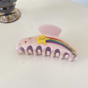 Pince à cheveux rose avec étoile jaune souriante rayures arc-en-ciel et petits strass