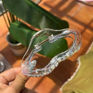 Transparent wavy heart hair claw clip in clear acrylic material with red dots pattern