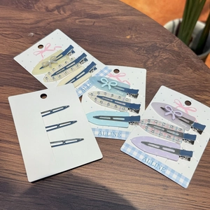 Detailset aus vier Acryl-Haarspangen mit Strasssteinen und bunten Mustern