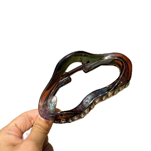 Cloud-shaped amber hair claw clip with wave design for high ponytail styling