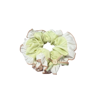 Sweet sea salt green scrunchie with button detail and bow tie for hair styling