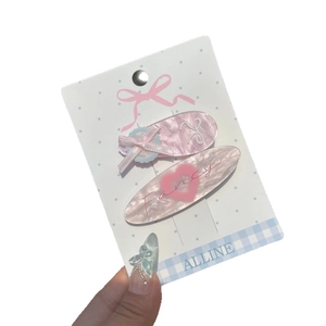 Set de barrettes roses avec cœur et nœud, texture marbrée et lettrage Fancy