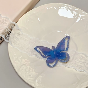 Elegant 3D hollow butterfly acetate hair clip in purple and blue gradient on ceramic tray