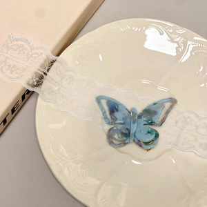 Elegant hollow butterfly hair clip in water blue acetate with a metallic duckbill grip
