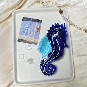 Sparkly dark blue seahorse hair claw clip made of acetate for ocean style hair styling
