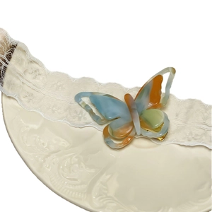 3D hollow butterfly acetate hair clip with marble texture on a white decorative plate