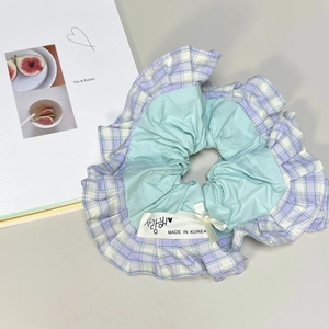 Mint green oversized hair scrunchie with plaid ruffle, bow, and pearl accent