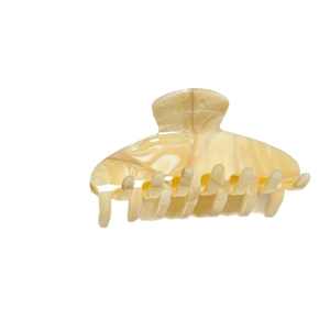 Elegant cream marble acetate hair claw clip with smooth curved design on white background