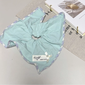 Mint green fabric scrunchie with purple plaid trim and pearl bow detail Korean style