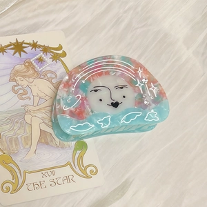 Star acetate hair claw clip with vintage celestial face and dreamy blue pink marble pattern