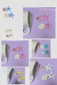 Détail de barrettes marines avec motifs d'étoiles de mer, coquillages et perles
