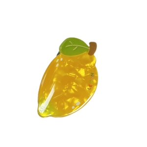 Translucent yellow lemon-shaped hair claw clip with lemon text and green leaf detail