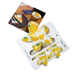 Floral lemon print hair clip set featuring mini cherry and strawberry fruit patterns