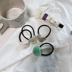 Minimalist French hair ties with marble resin accents and high elastic bands in soft colors