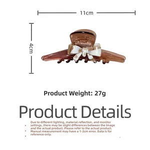 Brown acetate hair claw clip with black and white checkered bow, 11cm length size detail