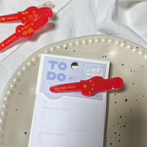 Chinese patriotic red heart hair clips with yellow five-pointed stars and text patterns
