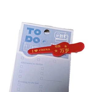 Patriotic red hair clip with golden I Love China text on a blue planner background