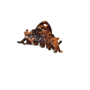 Elegant tortoise shell claw clip with phoenix texture and golden Barrette La France mark