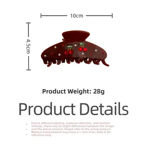 Detail showing red acetate hair claw clip with crystal cherry and 10cm size marking