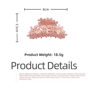 Détail de la pince à cheveux fleur rose avec strass, dimensions 8cm par 3,5cm