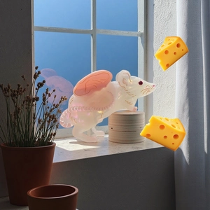 Cute flying mouse acetate hair claw clip in white and pink finish on wooden stand