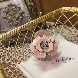 Pink rose claw clip with black outlines in a vintage French style hair accessory