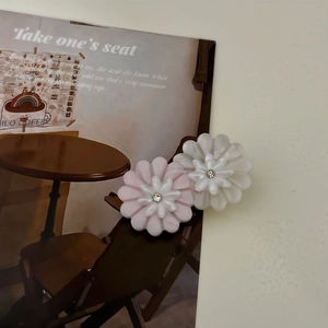 Elegant twin daisy flower hair clips with layered chiffon petals and central rhinestones
