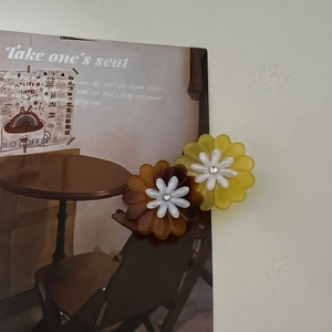 Elegant daisy flower hair clips in amber and yellow with center crystals and double petals