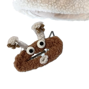 Barrette à cheveux marron duveteuse avec yeux de dessin animé et cornes tricotées