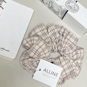 Chouchou élégant à carreaux abricot avec motif classique et style rétro raffiné