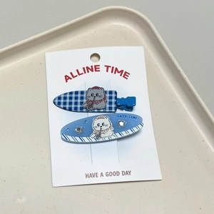 Detail of sweet cat-themed hair clips with rhinestones on branded display card