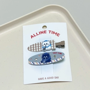 Cat themed hair clips set featuring cute patterns and rhinestones on a white tray